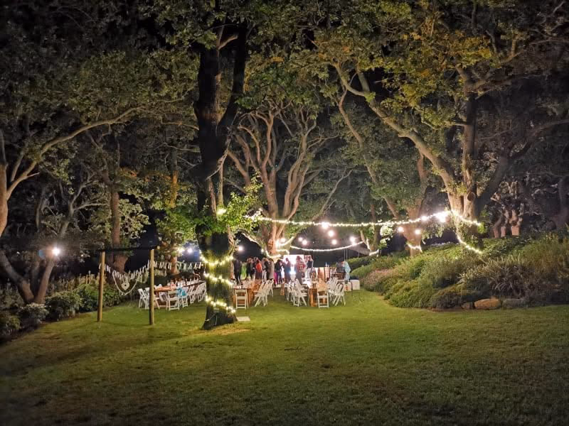 The Nidderdale garden lit for an outdoor evening celebration